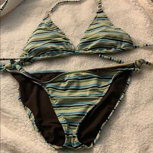 Striped bikini with circle charm details